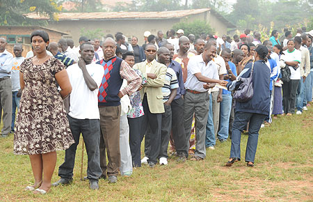 Voters line up behind their candaidate during the local government elections yesterday (Photo- T. Kisambira)