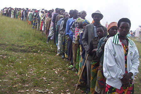 Residents line up to elect village cell advisory council representatives at Ngondore cell site yesterday (Photo by A.Gahene)