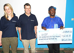 Jennifer Ollerenshaw and Nick Salisbury from Barclays Bank after presenting the dummy cheque to Dr Joseph Foumbi (Photo T.Kisambira)