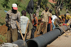 People working on laying a water pipe in Kigali City. RWASCO has invested heavily in the project (File Photo)