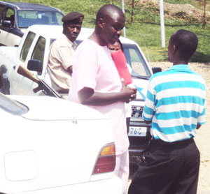 REMANDED Former Intelligence Officer (IO), Gaspard Rwegeranya talks to his lawyer (photo S Nkurunziza