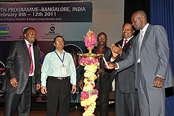 A Rwandan student lights a candle to mark the beginning of the Itorero in India. Looking on is Rwanda envoy to India, Williams Nkurunziza, Dr Sundararajan, Vice Chancellor, Jain University and NURC boss Dr Jean Baptiste Habyarimana (Courtesy Photo)