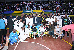 CHAMPIONS: Rwanda's men and women teams pose for a group photo with Prime minister Bernard Makuza (standing centre) after winning Zone V titles in both categories on Saturday. (E. Niyonshuti)