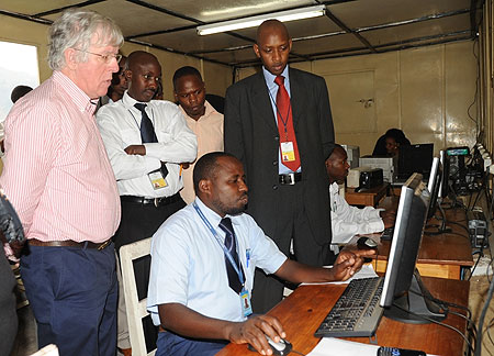 Dave Hartnett (L) being shown some of the facilities at Gatuna boarder post. (Photo J Mbanda)