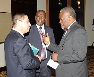 PALU President Akere Muna (R) chats with Hashim Abubaker (C) and another delegate chat during the meeting on Saturday. (Photo J Mbanda)