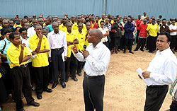 Gasabo District Executive Secretary Ibrahim Ndagijimana  talking to UTEXRWA employees on Monday as the company Chief Trivedi Deepak (R) looks on. (Photo J Mbanda)