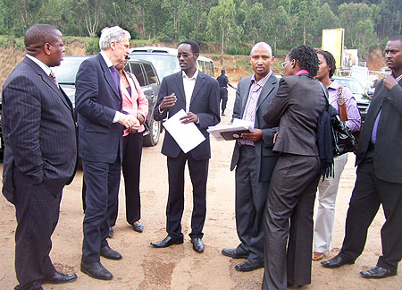 The visiting Dutch Minister, Dr. Ben Knapen, chats with community leaders from Gicumbi district during his tour of the Dutch funded projects in the Northern Province, yesterday. (Photo/A. Gahene)