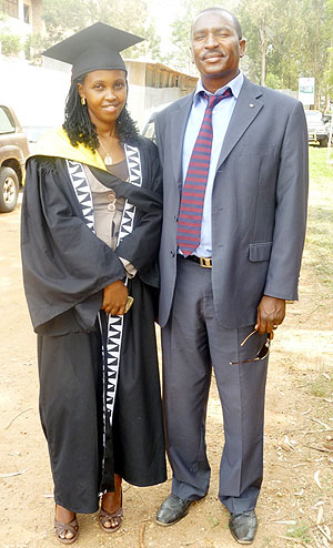 Charity Karungi (L) with a cousin brother on graduation day.