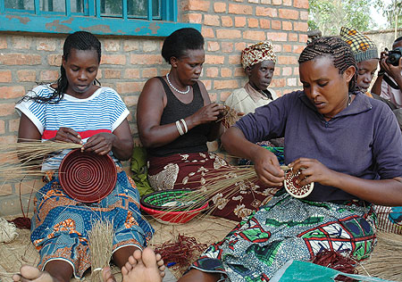 Women weaving Agaseke. Financial independence will curtail GBV (File Photo)