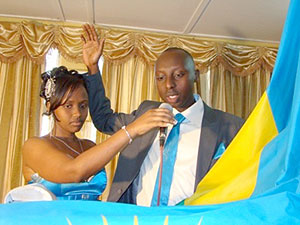 Aime Uwimana lifting up his right hand exchanging vows with wife to be Claire Uwayezu at Nyarugenge Sector (Net Photo)