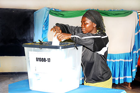 One of the voters casting her vote at Rugunga polling station. . (Photo T. Kisambira)