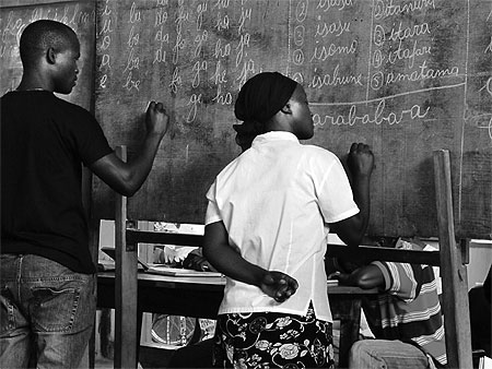 Some of the adults learning how to write in class (Photo T.Kisambira)