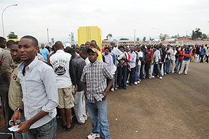 Permit applicants queue up to register. Police has introduced online registration (File Photo)