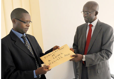 State Minister for primary and Secondary Education, Mathias Harebamungu, (L) with RNEC Executive Secretary, John Rutayisire, after releasing the results yesterday (Photo: J Mbanda)