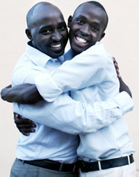 Justus Karenzi (R) one of the best science students is congratulated by his brother Frank Ntaganzwa after the results were released