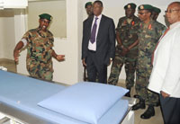 Defence Minister Gen James Kabarebe (in suit) and some senior Army officers look at some equipment in Kanombe Hospital. (Photo T Kisambira)