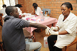 A young man voluntarily tests for HIV at Gikomero Health Centre. (Photo J Mbanda)