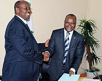 Minister James Musoni (R), with the UN Resident Coordinator Aurelien Agbenonci after signing yesterday (Photo T.Kisambira)