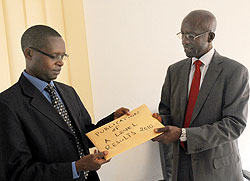 State Minister Mathias Harebamungu (L) receiving results from RNECu2019s John Rutayisire. Anomailes have been reported in A Level results (Photo J Mbanda)