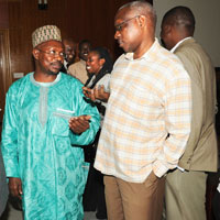 EALA MP Abdul-Karim Harelimana (L) talks to RDB's Emmanuel Werabe. (Photo J Mbanda)