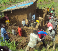 Residents helping to build a house for one of the vulnerable residents during the ongoing women's week (photo S Nkurunziza)