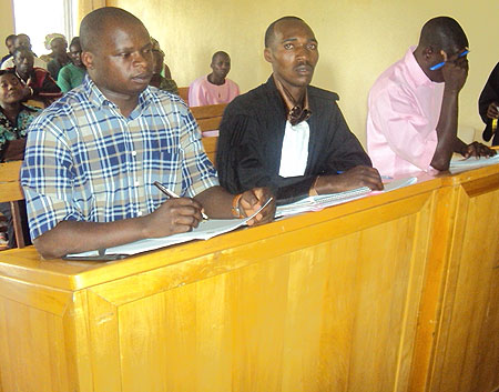 (L-R) Former Rutsiro mayor Jean Ndimubahire, his attoney and co accused Jean Pierre Nsabimana before court yesterday (Photo: S. Nkurunziza)