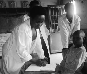 Teachers personally attend to mentally disabled children. (photo S Nkurunziza)