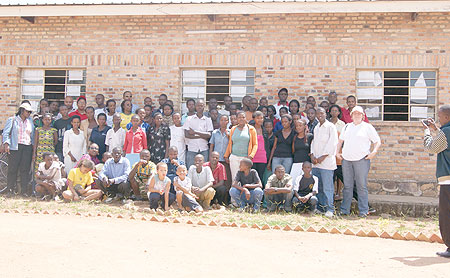 Orphans pose for the photo with Rwanda Events Management team and a group of musicians.