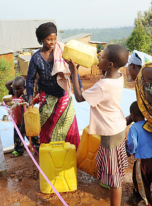 The residents were happy to recieve clean water (Photo T. Kisambira)