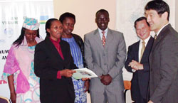 Minister Stanislas Kamanzi (C) and Ambassador Hatanaka Kunio flanked by other officials. (Photo S. Rwembeho)