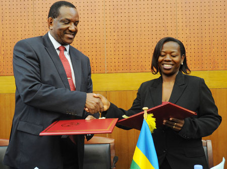 Minister Monique Nsanzabaganwa (R), and Kenyan Co-operatives Minister, Joseph Nyaga, after signing the MoU, yesterday (Photo T.Kisambira)