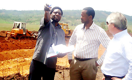 BRD Boss Jack Kayonga, (C) during a visit at the site for the Kinazi Cassava Factory. (Photo D Sabiiti)