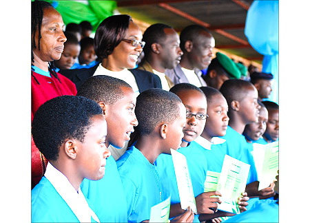 The best performing girls in a group photo with, (L-R), DG Imbuto Foundation - Radegonde Ndejuru, Speaker of Parliament - Rose Mukantabana and the Governor of the Southern Province - Alphonse Munyentwali  and Huye mayor Eugene Kayiranga. (Courtesy Photo)