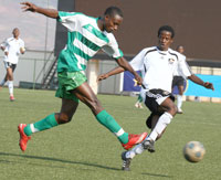 TAKE THAT: SC. Kiyovu striker Eric Serugaba takes a clean strike against APR during the pre-season tournament. Kiyovu players are yet to get their february salaries. (File photo)