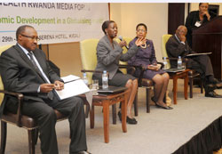 (L-R) Ministers Protais Musoni and Louise Mushikiwabo with Commonwealthu2019s Mmasekgoa Masire-Mwamba, and Charles C.Okigbo, a Communications expert (Photo T.Kisambira)