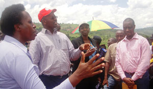 Minister James Musoni (C), Minister Agnes Kalibata (second R) and Governor Aisa Kirabo Kacyira (L) talking to residents of Kirehe district. Photo S Rwembeho