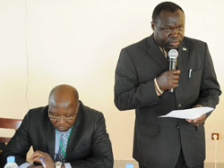 (R-L) Forestry Minister, Christophe Bazivamo and Roger Louis Essola Etoa of CEFHDAC during the meeting yesterday (Photo T.Kisambira)