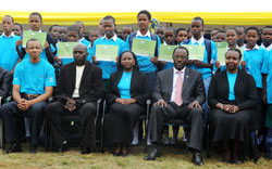 (L-R) The Best performers in a group photo with (L-R -seated) MP Thiery Karemera, Mayor of Kicukiro -Paul Jules Ndamage, Minister Solina Nyirahabimana, Mayor of Kigali - Fidele Ndayisaba, and Nina Shalita, the Deputy DG of Imbuto (Photo T.Kisambira)