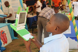 A child admires its laptop from the One laptop per child initiative (File photo).