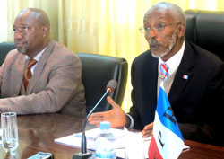 RPF Secretary General Francois Ngarambe (R) addresses journalists as Commissioner Wellars Gasamagera looks on.(Photo J Mbanda).