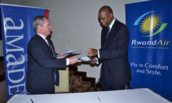 Amadeusu2019s, Sub-Sahara Africa Regional Business Development Manager, Aymeric Lanezat shaking hands with Rwandairu2019s CEO, John Mirenge after signing the partnership