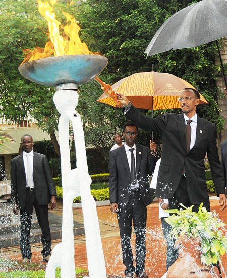 President Kagame lights the flame at Gisozi GenocideMemorial site yesterday. (Photo J Mbanda)