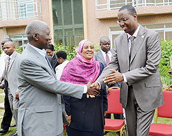 Youth Minister Protais Mitali (R) greets EALA legislator Hon.Said Bilal as Hon. Sebtuu Mohamed Nassor looks on. (Photo J Mbanda)