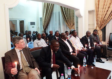 Rwandan Ambassador to DRC Amandin Rugira (Placing a candle on table) together with other envoys during the 17th commemoration of the 1994 Genocide against the Tutsi