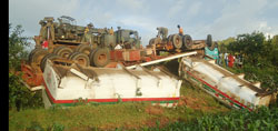 The scene of the accident that left a Somali national dead, and diesel oil spilling to nearby rice farms.Photo D.Sabiiti