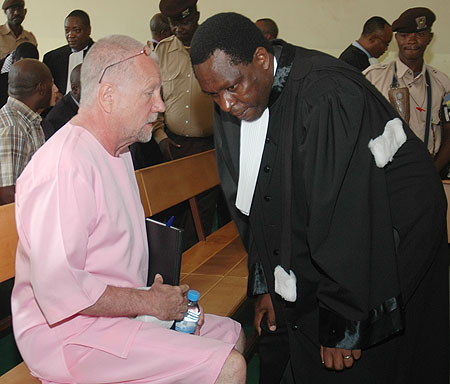 Peter Erlinder discussing with his lawyers at the High. (File photo)