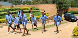 EFAK School pupils walk to school through the newly paved passage. (Photo J Mbanda)