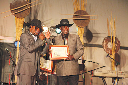 Veteran artist, Abdul Makanyaga (right) was honoured at the event.(All photos by T.Kisambira)