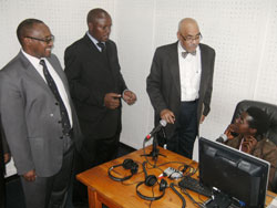 Minister Protais Musoni and other officials inspecting the Community Radio newsroom (Photo S. Nkurunziza)