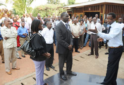 Natural Resources Minister, Stanislas Kamanzi (C), and other employees of the ministry being taken around the memorial centre (Photo J Mbanda)